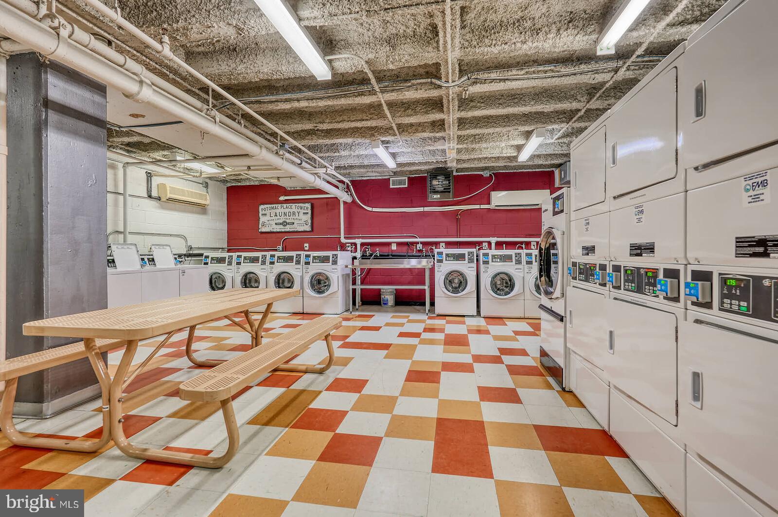 800 4th Street Southwest, Unit S623 Washington, DC 20024 - Photo 34 of 49 a utility room with stainless steel appliances and chairs