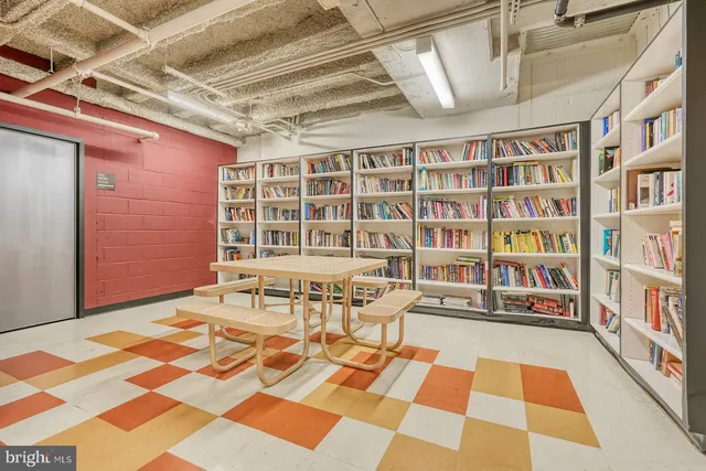 a patio with a table and chairs under an umbrella