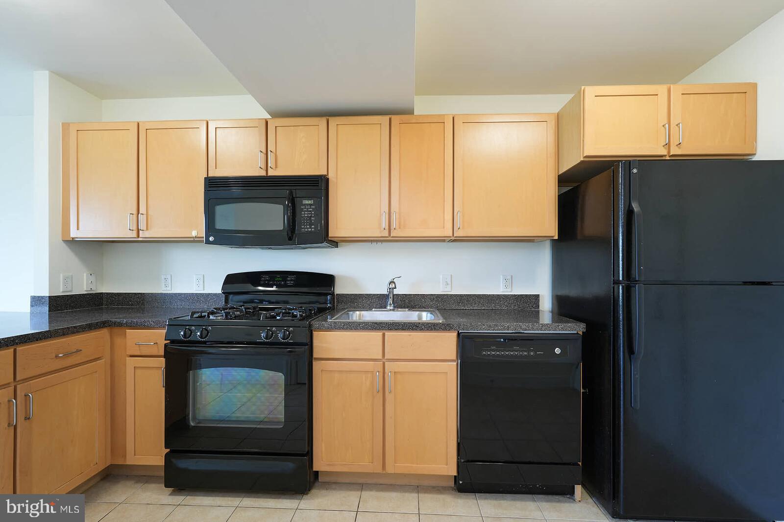 800 4th Street Southwest, Unit S623 Washington, DC 20024 - Photo 6 of 49 a kitchen with a sink stove and refrigerator