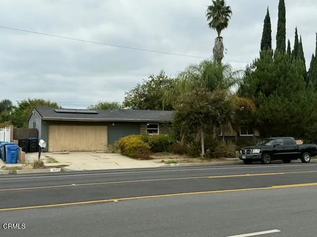 a view of street with parked cars