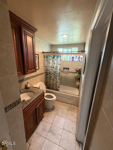 1277 Erringer Road Simi Valley, CA 93065 - Photo 5 of 6 a bathroom with a granite countertop sink toilet and shower