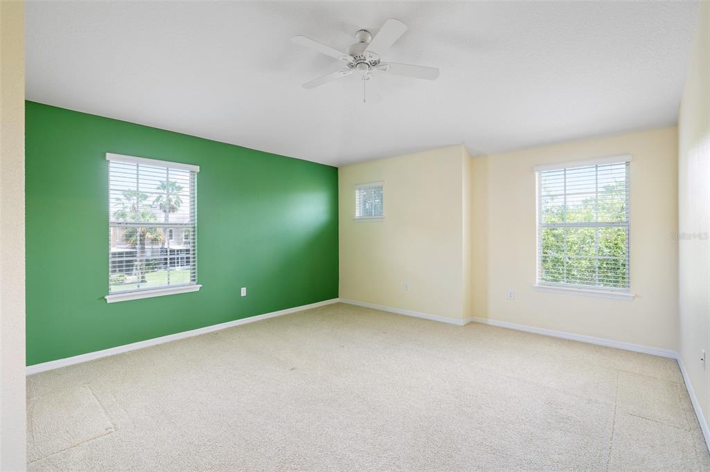 7001 Interbay Boulevard, Unit 303 Tampa, FL 33616 - Photo 16 of 37 an empty room with a window and a ceiling fan