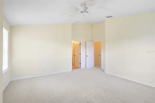 a bathroom with a granite countertop sink mirror and a bathtub