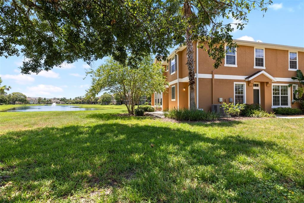 7001 Interbay Boulevard, Unit 303 Tampa, FL 33616 - Photo 25 of 37 a front view of a house with garden and trees