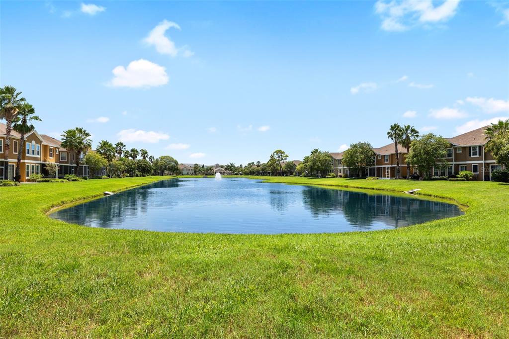 7001 Interbay Boulevard, Unit 303 Tampa, FL 33616 - Photo 30 of 37 a view of a lake with houses in the background