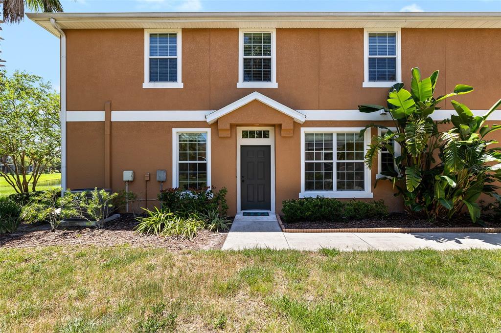 7001 Interbay Boulevard, Unit 303 Tampa, FL 33616 - Photo 5 of 37 a front view of a house with garden