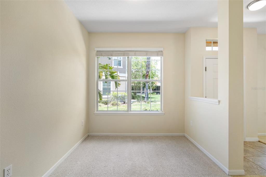 7001 Interbay Boulevard, Unit 303 Tampa, FL 33616 - Photo 7 of 37 an empty room with a window