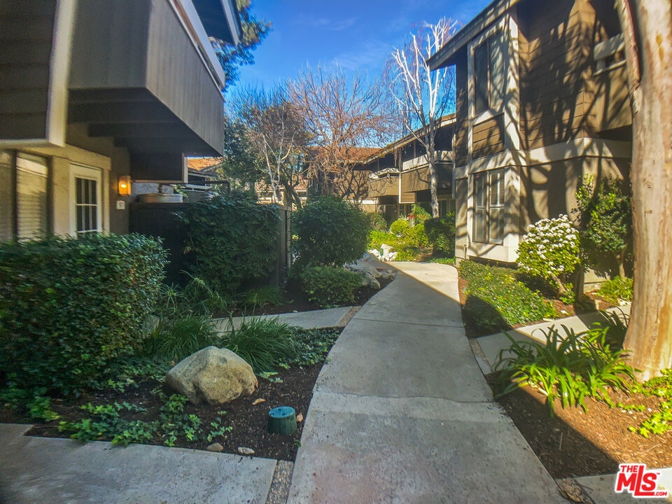 99 Streamwood Irvine, CA 92620 - Photo 8 of 12 a view of a garden with pathway