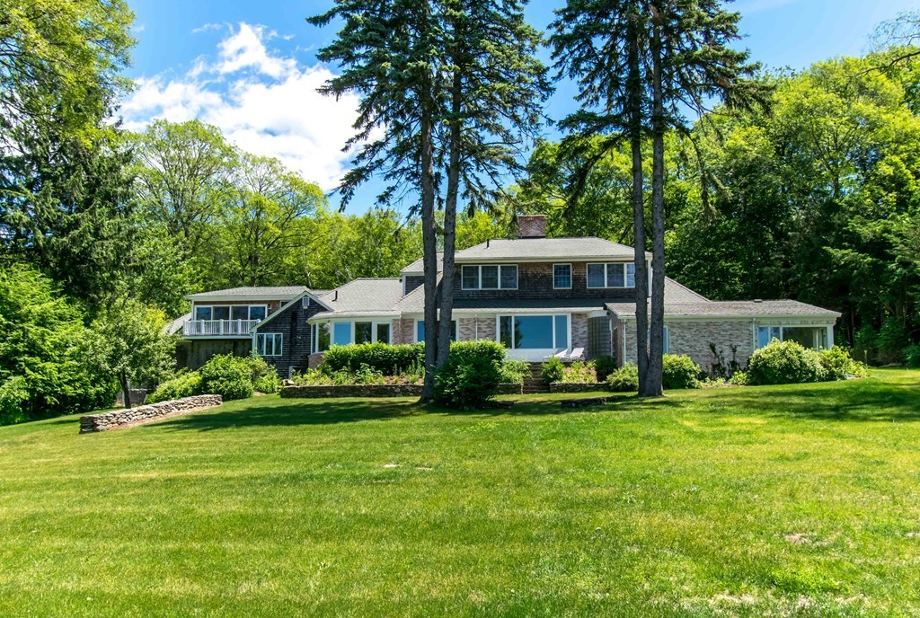 575 Ridge Road Wilbraham, MA 01095 - Photo 2 of 30 a front view of a house with a yard table and chairs