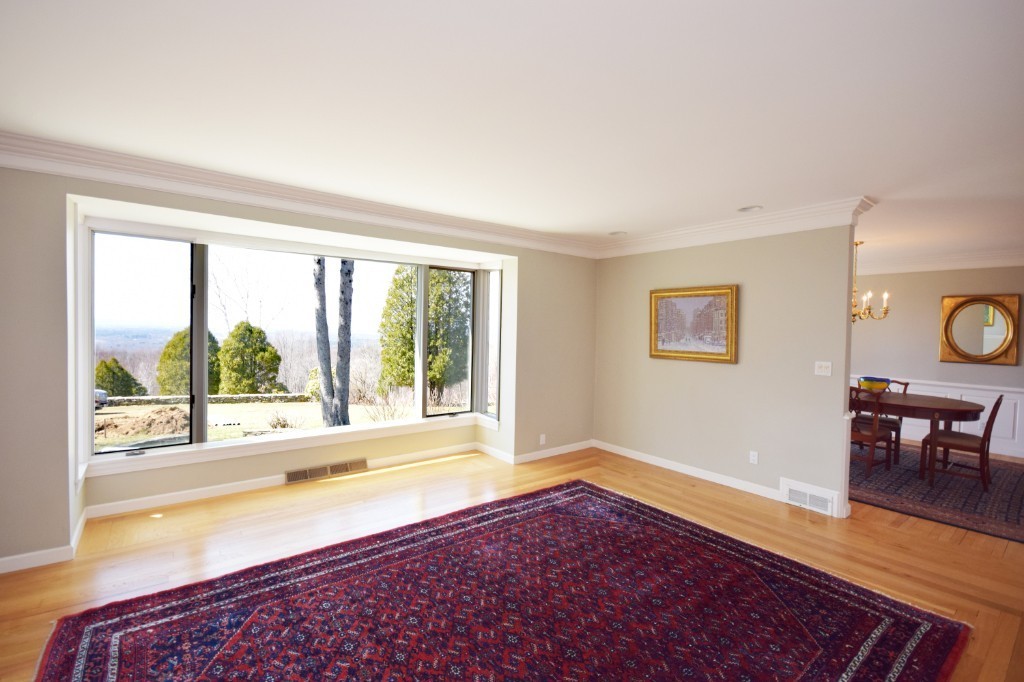 575 Ridge Road Wilbraham, MA 01095 - Photo 10 of 30 a view of an empty room with wooden floor and a window