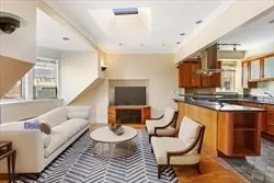 a living room with furniture and a chair