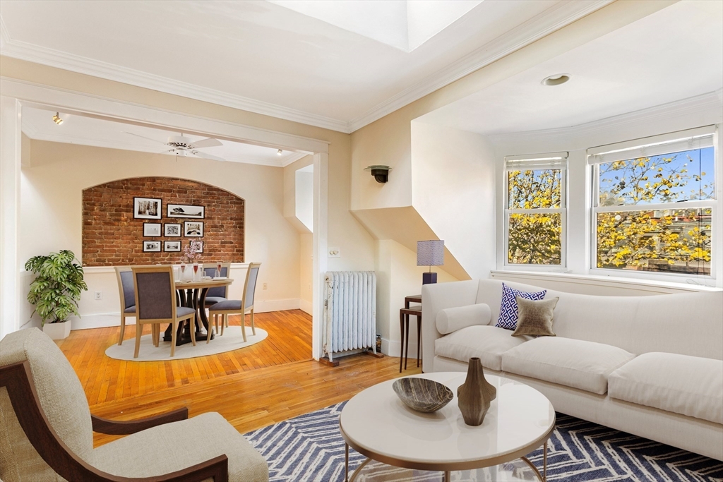 41 Worcester Square, Unit 8 Boston, MA 02118 - Photo 3 of 11 a living room with furniture and a large window