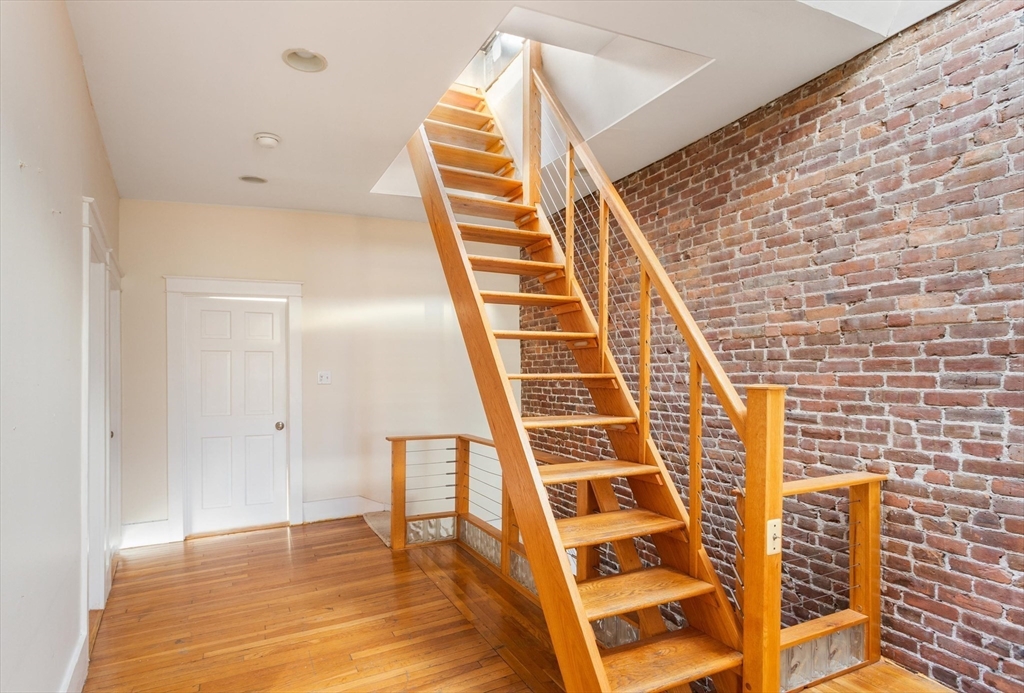 41 Worcester Square, Unit 8 Boston, MA 02118 - Photo 5 of 11 a view of wooden staircase and a bathroom