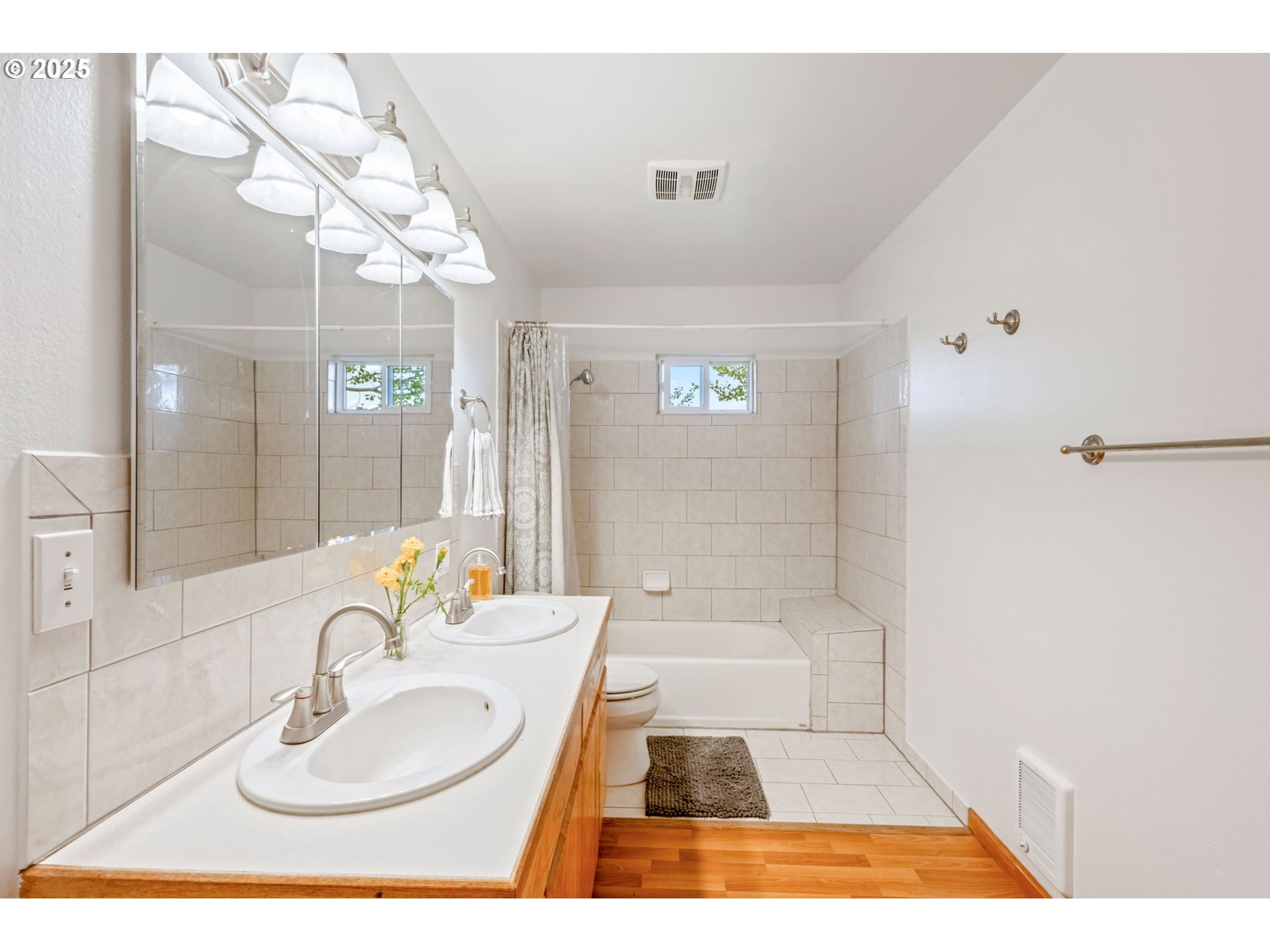 26315 Walker Road Bend, OR 97701 - Photo 13 of 45 a bathroom with a sink a toilet a mirror and shower