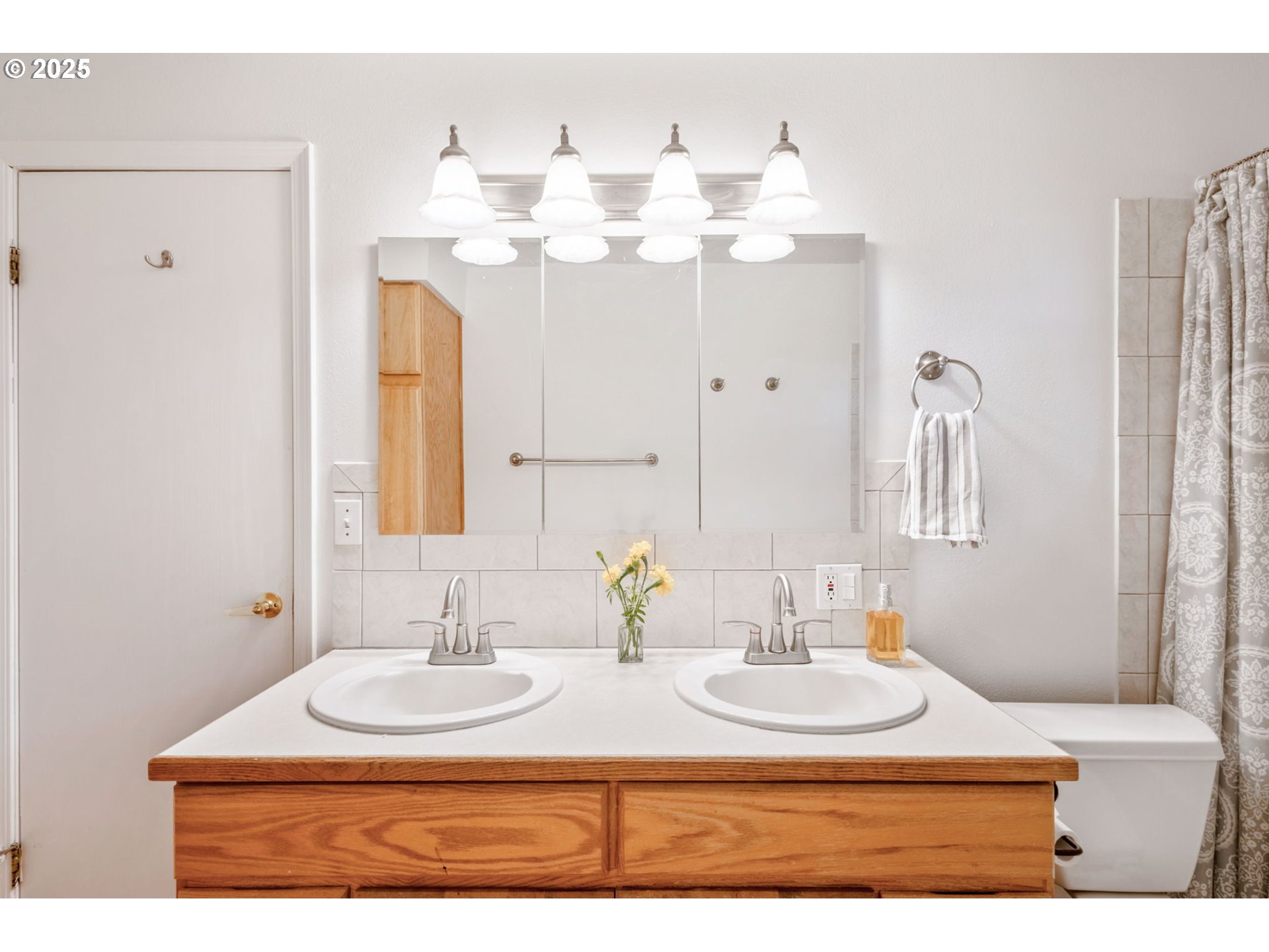 26315 Walker Road Bend, OR 97701 - Photo 14 of 45 a bathroom with a sink and a mirror