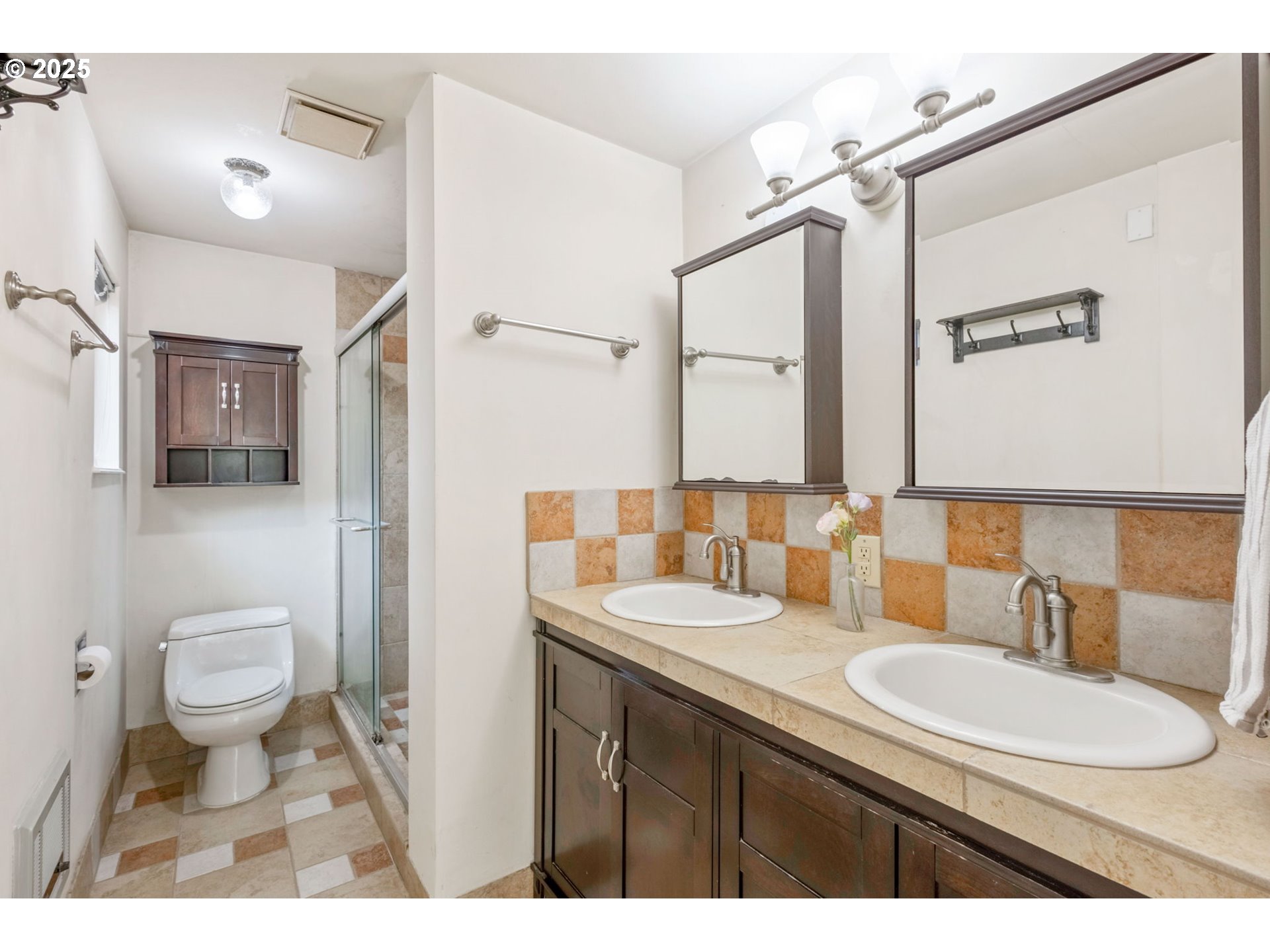 26315 Walker Road Bend, OR 97701 - Photo 15 of 45 a bathroom with a sink toilet a mirror and vanity