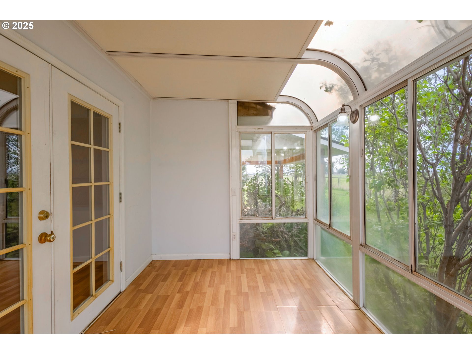 26315 Walker Road Bend, OR 97701 - Photo 24 of 45 a view of empty room with windows and wooden floor