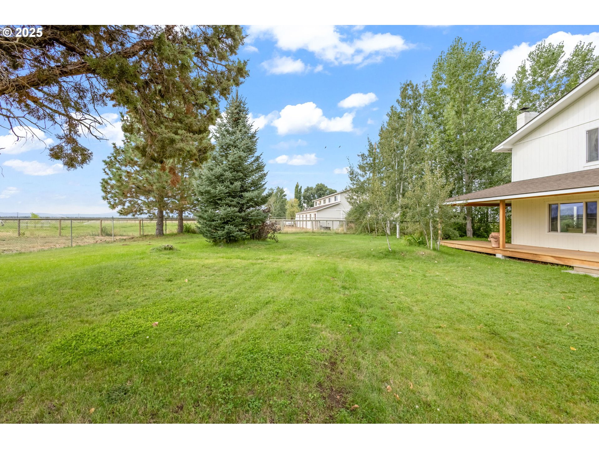 26315 Walker Road Bend, OR 97701 - Photo 28 of 45 a backyard of a house with lots of green space