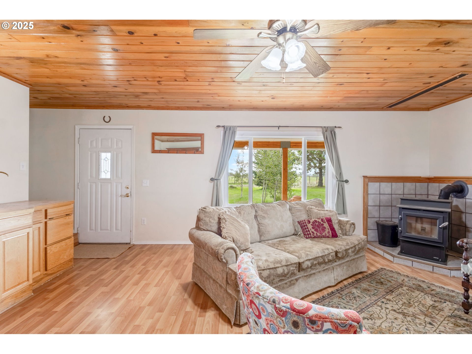 26315 Walker Road Bend, OR 97701 - Photo 3 of 45 a living room with furniture and a fireplace