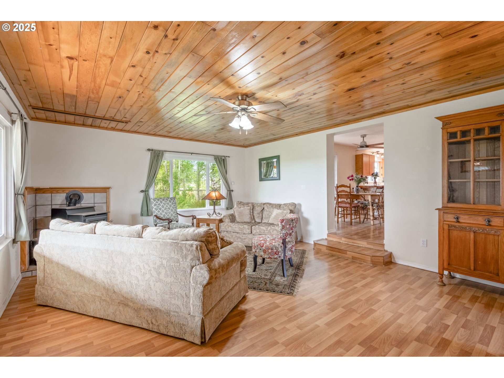 26315 Walker Road Bend, OR 97701 - Photo 4 of 45 a living room with furniture a wooden floor and a large window