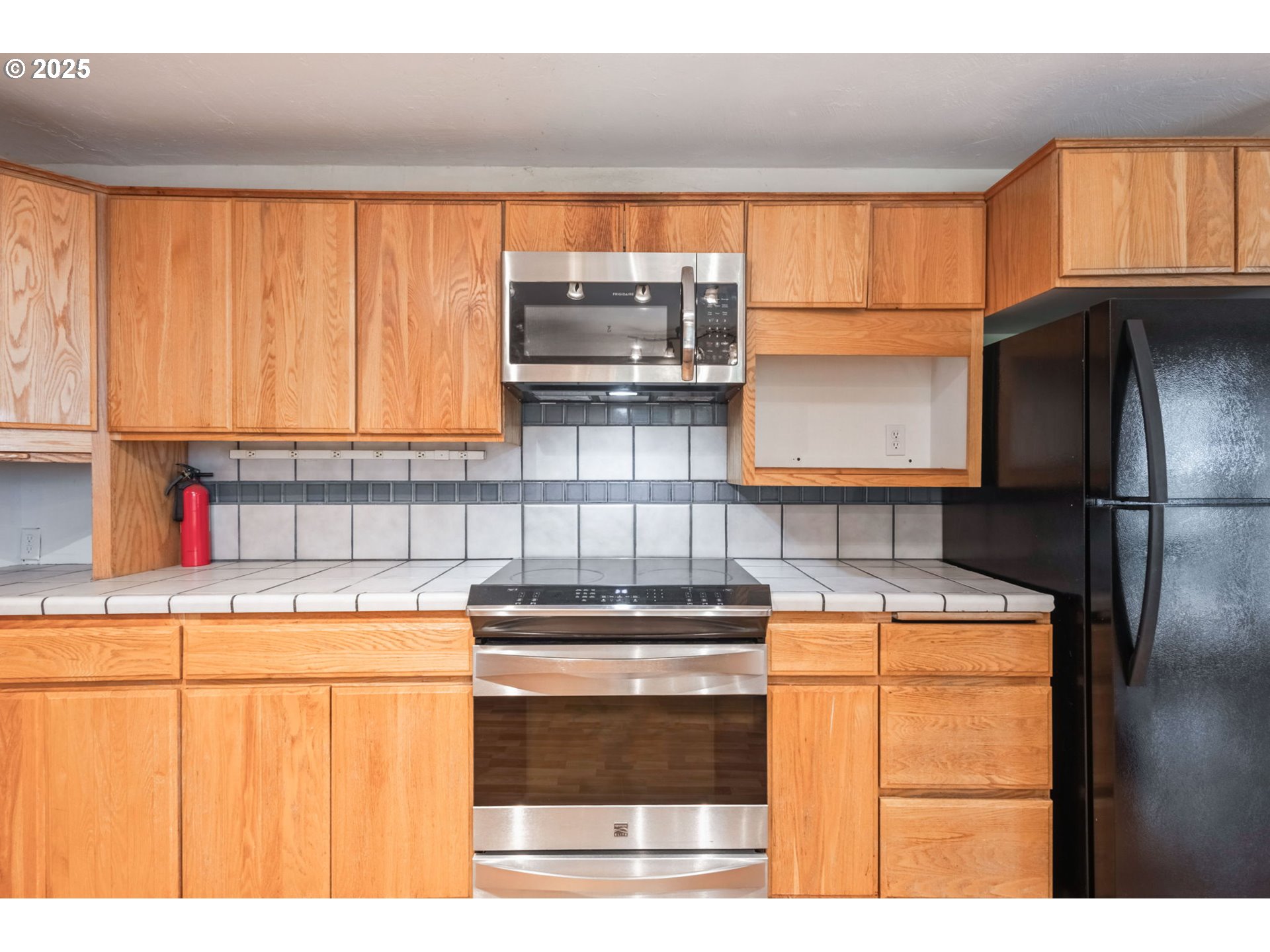 26315 Walker Road Bend, OR 97701 - Photo 7 of 45 a kitchen with stainless steel appliances granite countertop a sink and a refrigerator