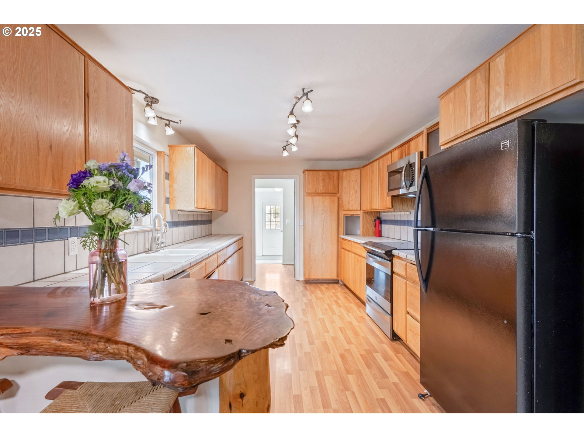 26315 Walker Road Bend, OR 97701 - Photo 8 of 45 a kitchen with furniture and a refrigerator