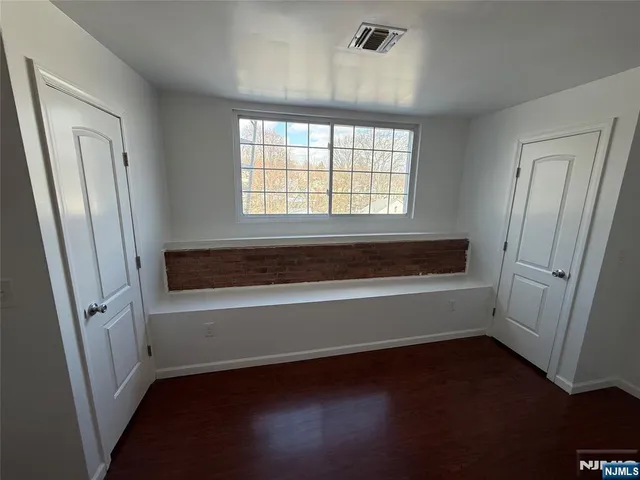 wooden floor with window in an empty room