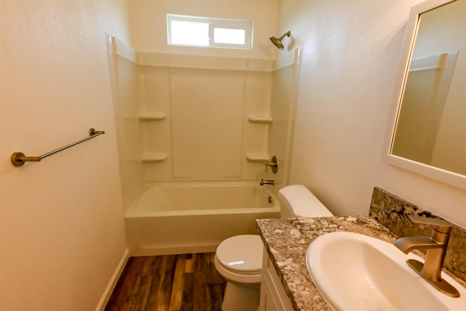 18071 Daley Road Madera, CA 93638 - Photo 14 of 25 a bathroom with a sink toilet and shower