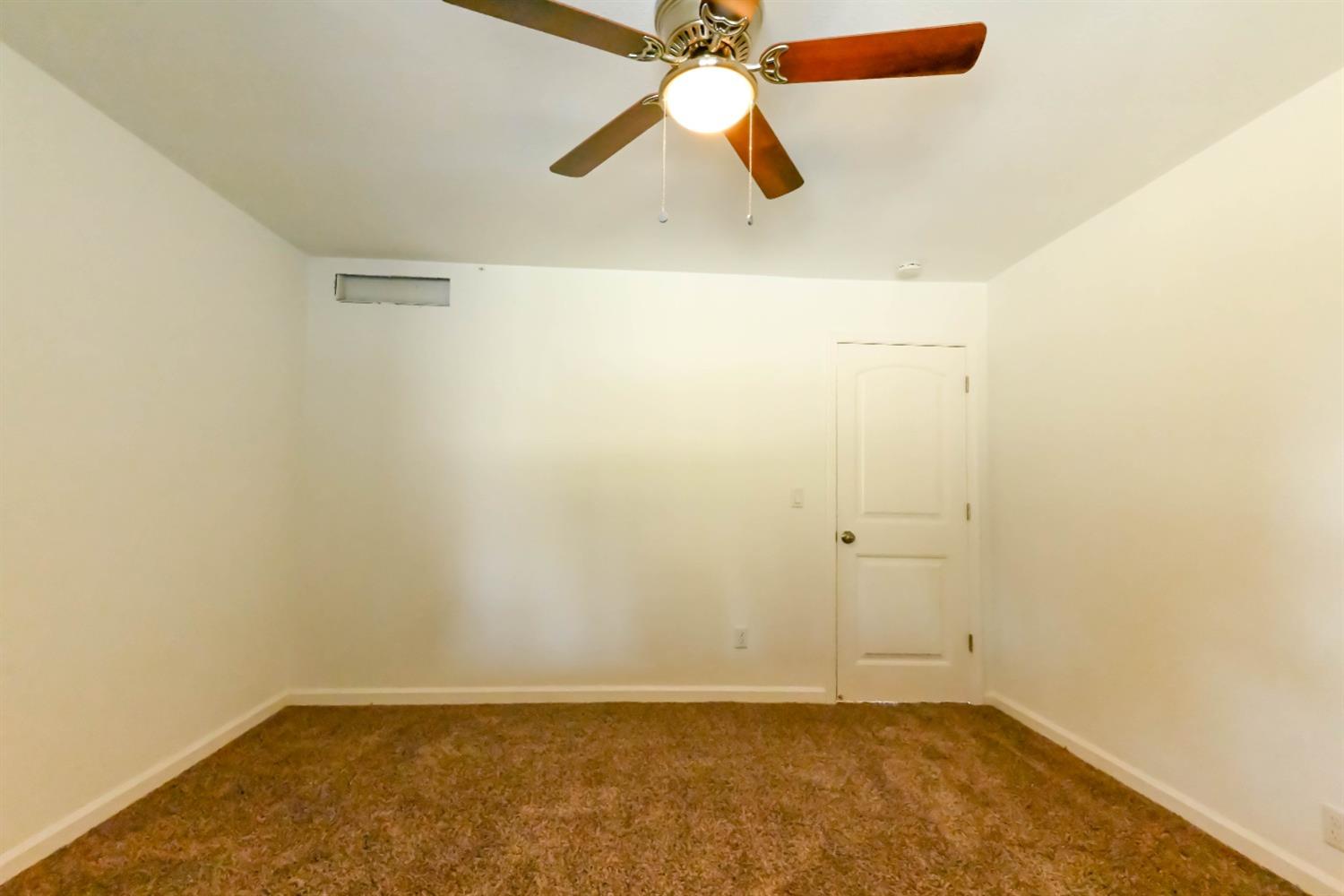 18071 Daley Road Madera, CA 93638 - Photo 20 of 25 an empty room with closet and fan