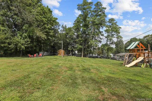 a backyard of a house with lots of green space