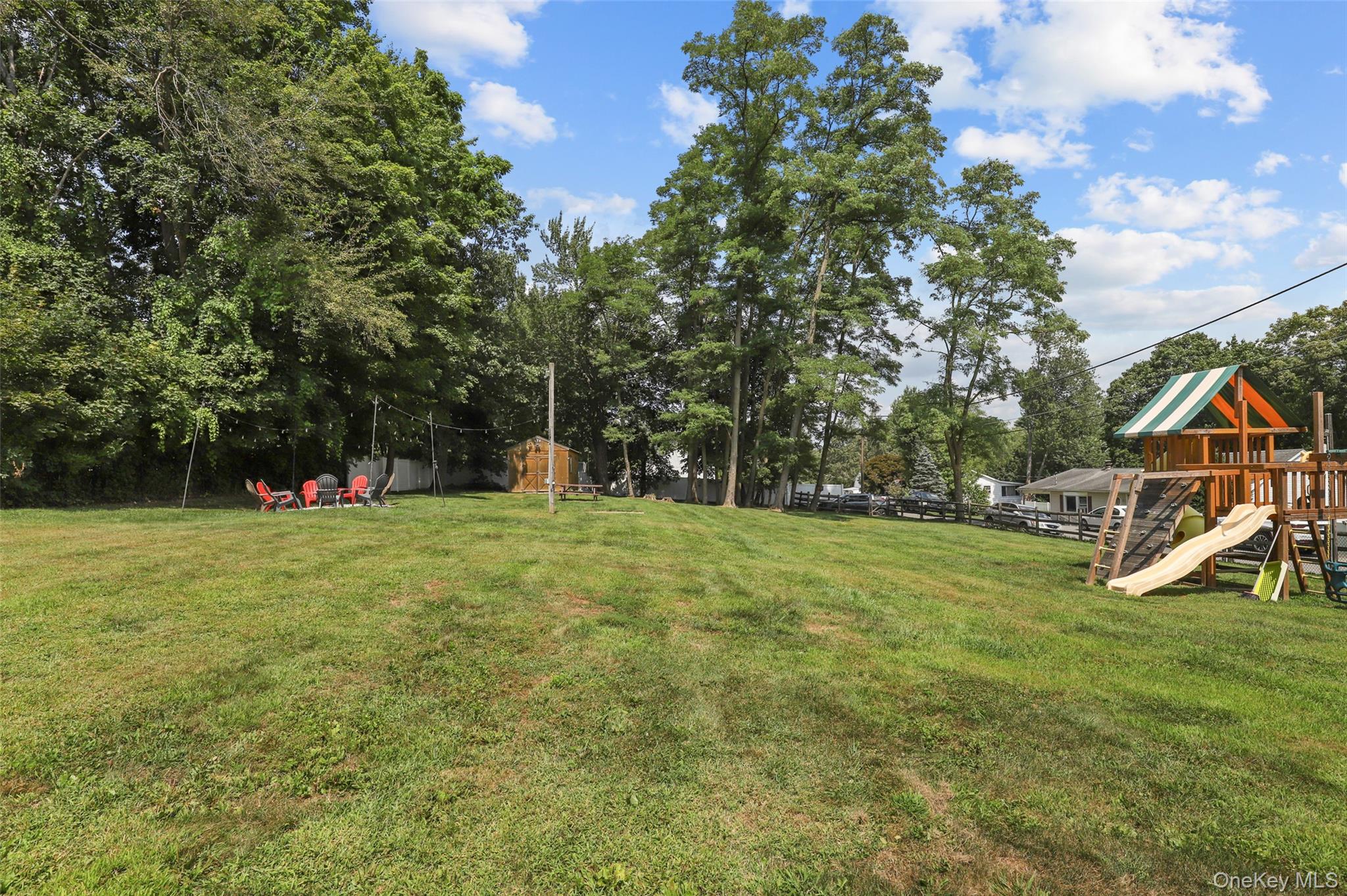 a backyard of a house with lots of green space