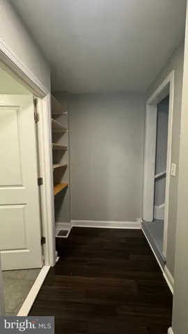 a utility room with a sink a mirror and vanity