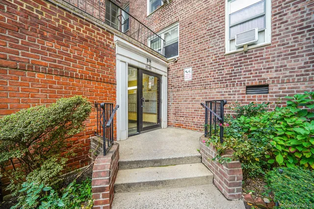 a view of entrance gate of brick building