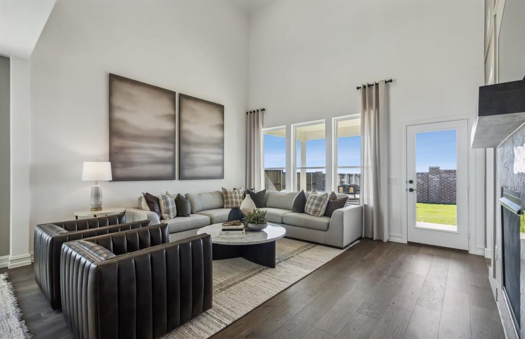 308 Brookhurst Road Little Elm, TX 75068 - Photo 6 of 19 Expansive gathering room bathed in natural sunlight *Model representation