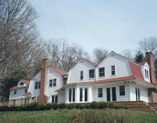 20 Governors Lane Fairfield, CT 06824 - Photo 1 of 1 a front view of a residential houses with yard and trees