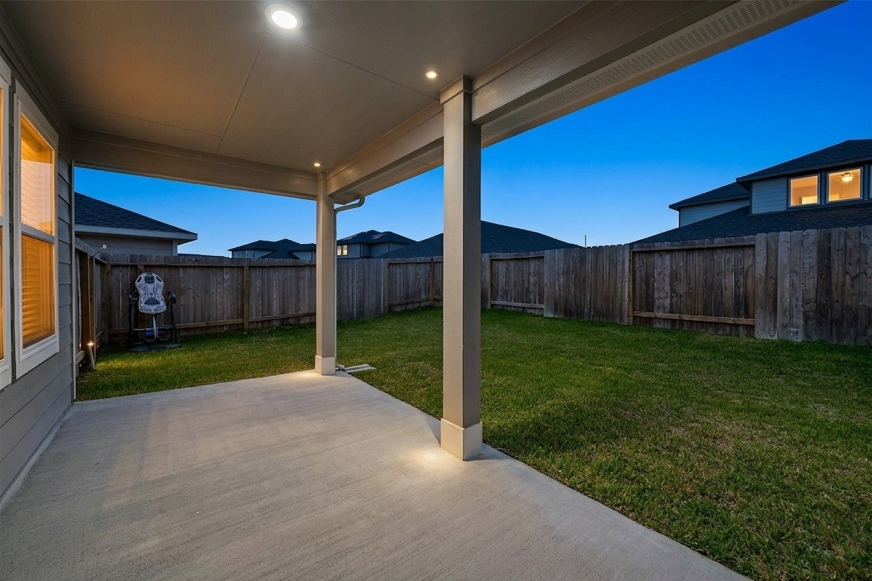 4320 Rustling Aspen Drive Rosenberg, TX 77469 - Photo 42 of 49 Enjoy outdoor living with a covered patio and a spacious backyard, perfect for hosting and relaxation ***Twilight Enhanced Photo***