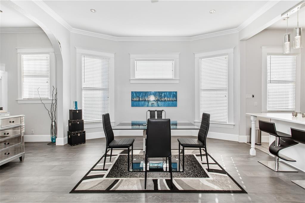 4719 Junius Street, Unit 1 Dallas, TX 75246 - Photo 12 of 40 a dining room with furniture and window