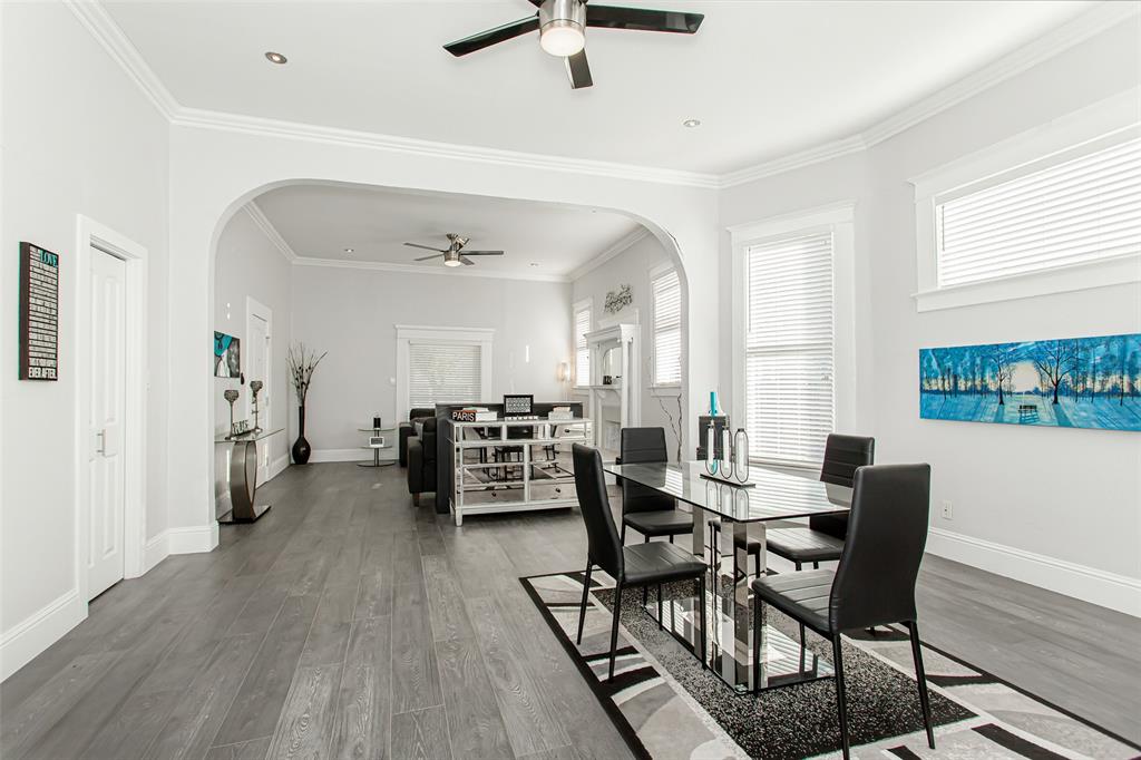 4719 Junius Street, Unit 1 Dallas, TX 75246 - Photo 14 of 40 a view of a dining room with furniture and wooden floor