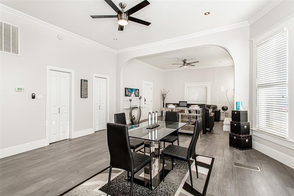 4719 Junius Street, Unit 1 Dallas, TX 75246 - Photo 15 of 40 a view of a dining room with furniture and wooden floor