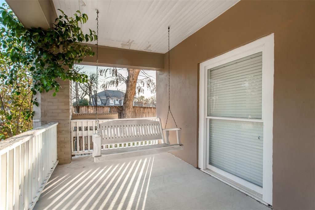 4719 Junius Street, Unit 1 Dallas, TX 75246 - Photo 2 of 40 a view of a porch with wooden floor