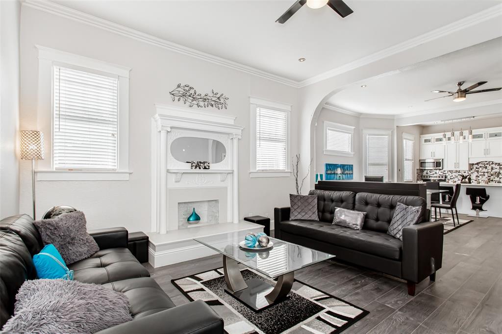 4719 Junius Street, Unit 1 Dallas, TX 75246 - Photo 6 of 40 a living room with furniture and a fireplace