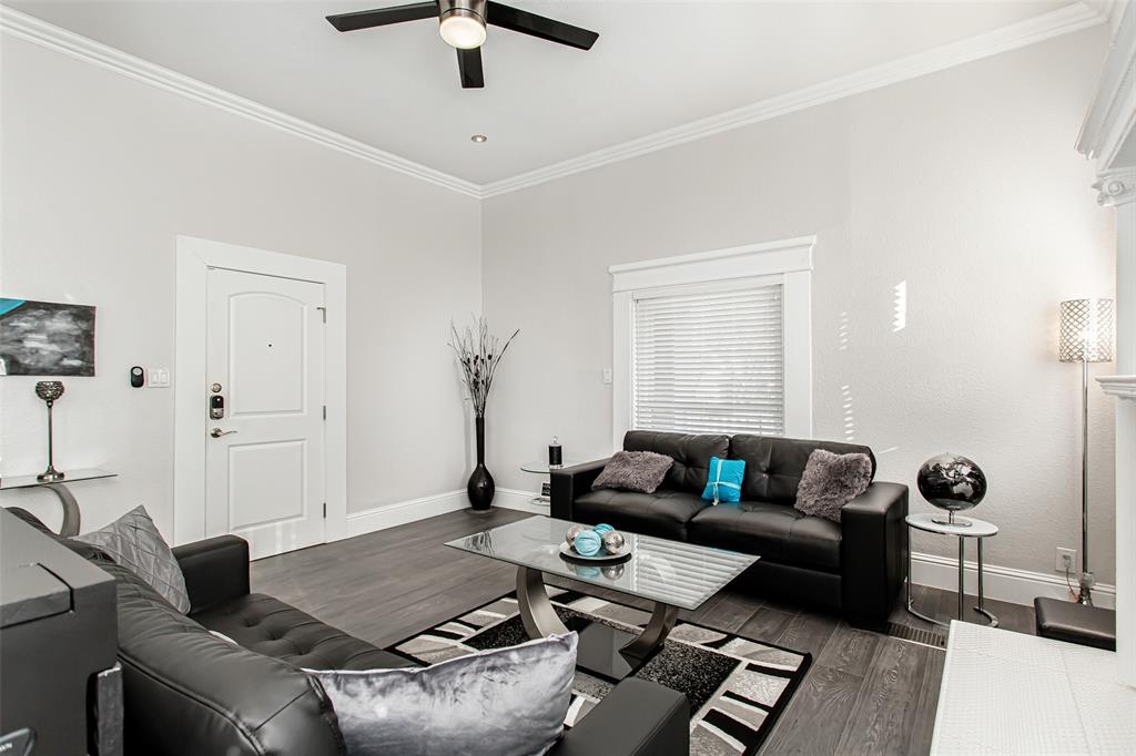 4719 Junius Street, Unit 1 Dallas, TX 75246 - Photo 9 of 40 a living room with furniture and a window