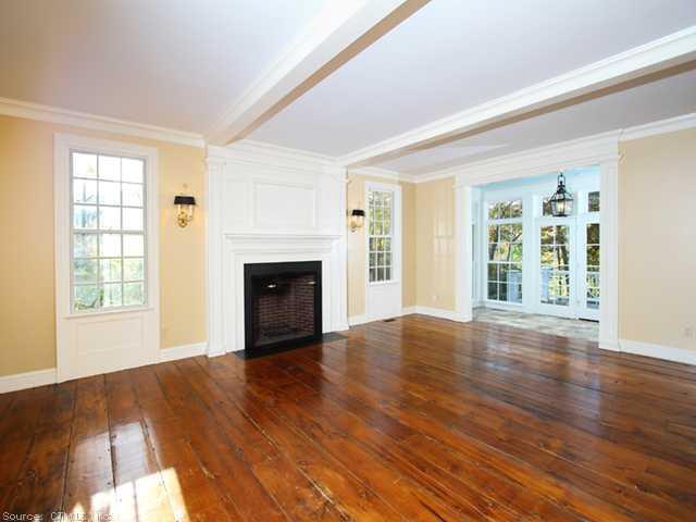 446 Hamburg Road Lyme, CT 06371 - Photo 1 of 1 a view of empty room with wooden floor and fireplace