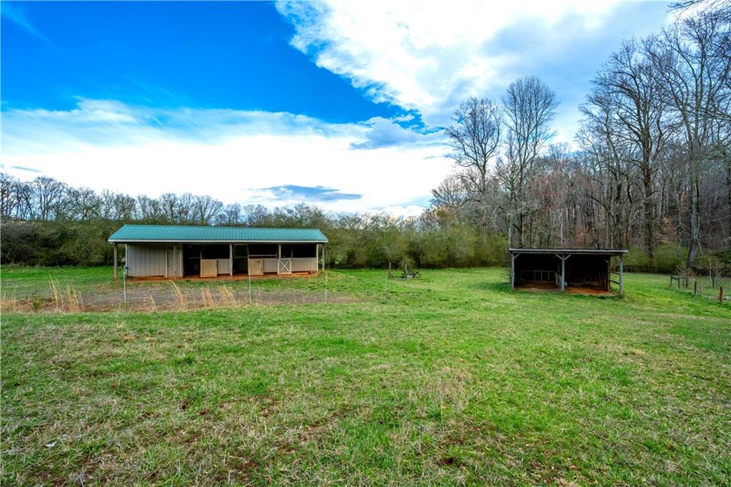 Lot 18 Bear Creek Road Statham, GA 30666 - Photo 11 of 21 a view of a house with a backyard