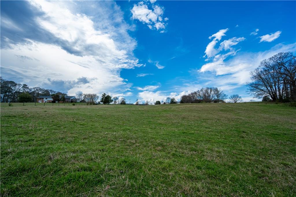 Lot 18 Bear Creek Road Statham, GA 30666 - Photo 17 of 21 a view of a golf course with a lake