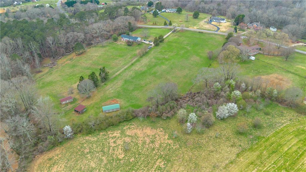 Lot 18 Bear Creek Road Statham, GA 30666 - Photo 5 of 21 a view of a yard with yellow plants