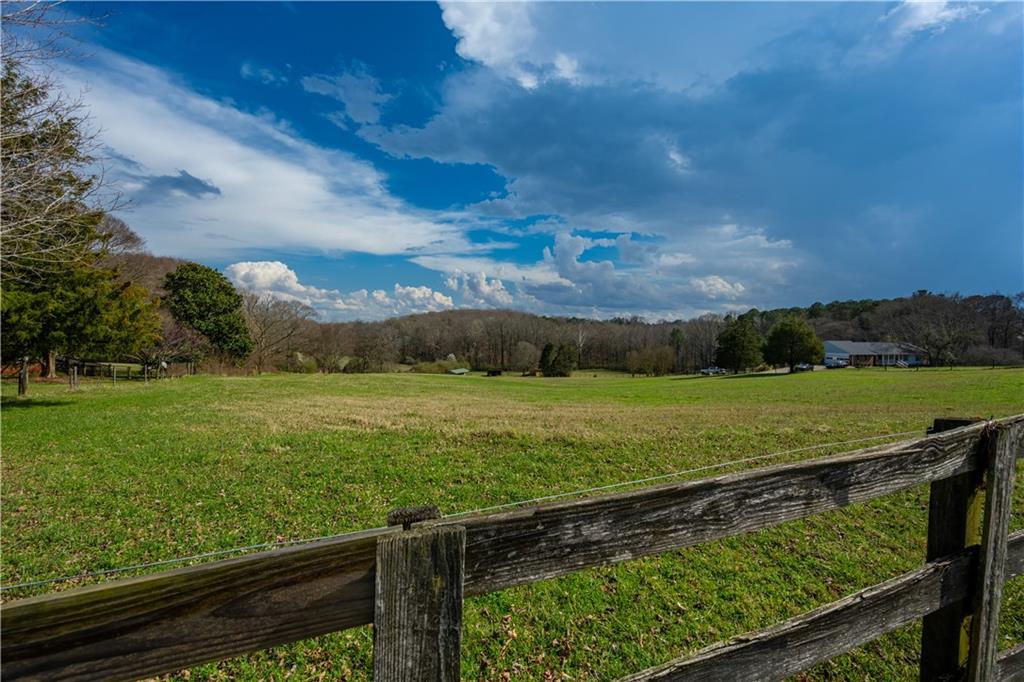 Lot 18 Bear Creek Road Statham, GA 30666 - Photo 6 of 21 a view of a yard with wooden fence