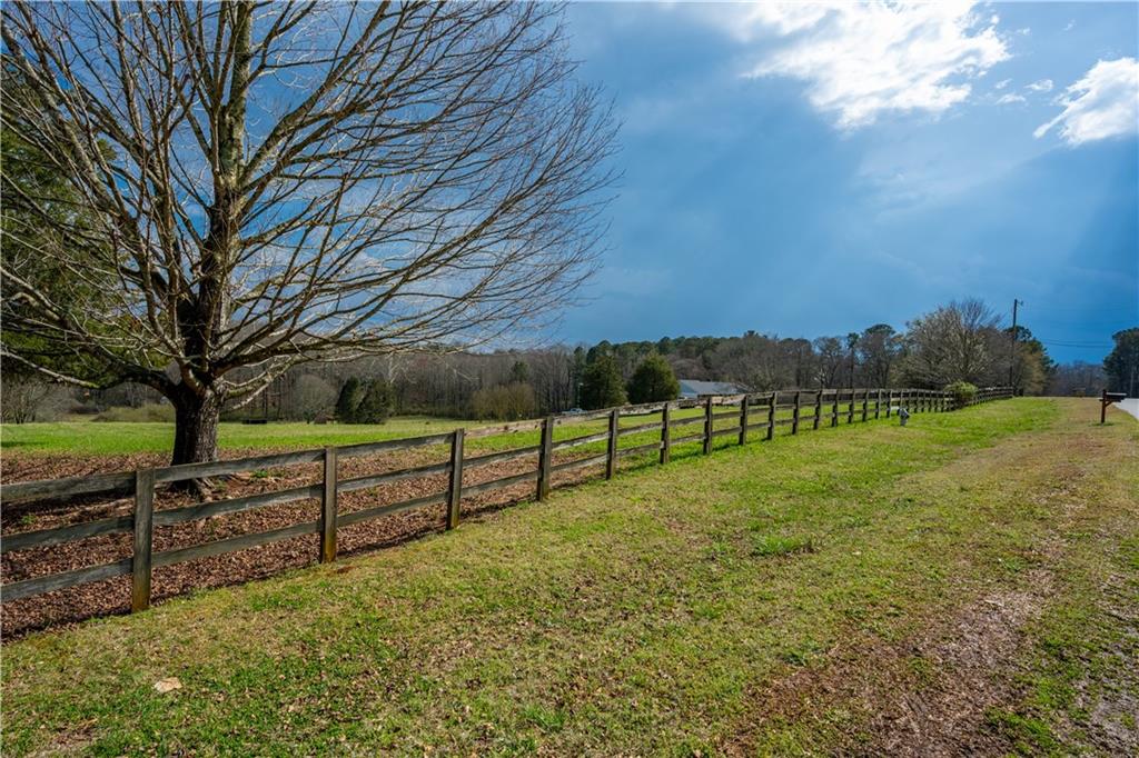 Lot 18 Bear Creek Road Statham, GA 30666 - Photo 7 of 21 a view of a yard with wooden fence