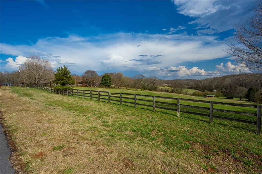 Lot 18 Bear Creek Road Statham, GA 30666 - Photo 8 of 21 a view of a bench in middle of the green field