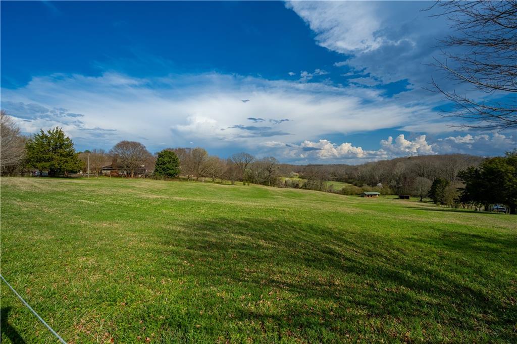 Lot 18 Bear Creek Road Statham, GA 30666 - Photo 9 of 21 a view of a field with an trees
